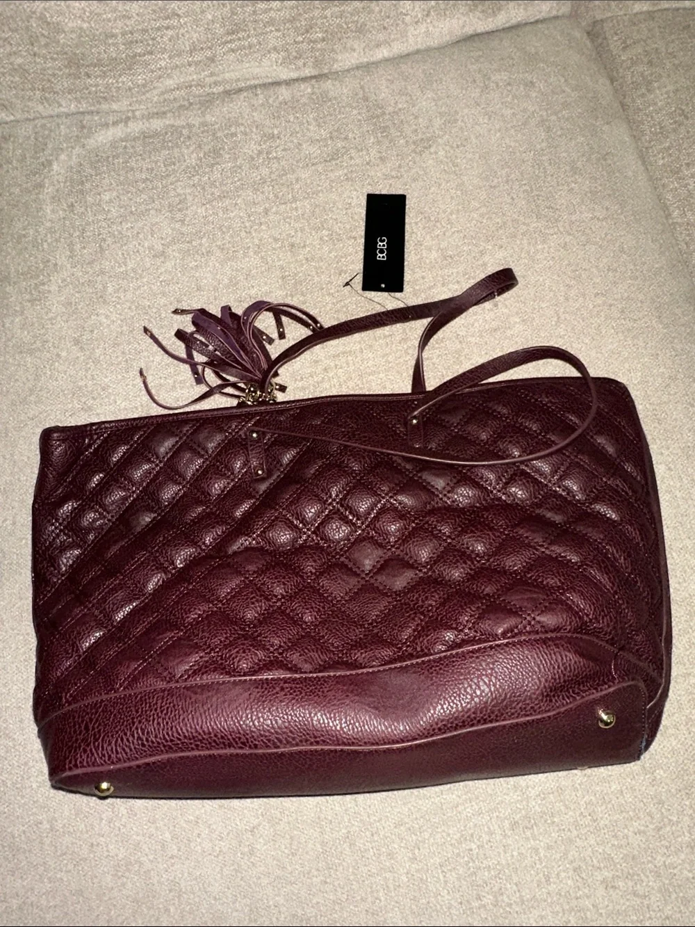 BCBG Quilted Tote Bag in Burgundy with Tassel Accent